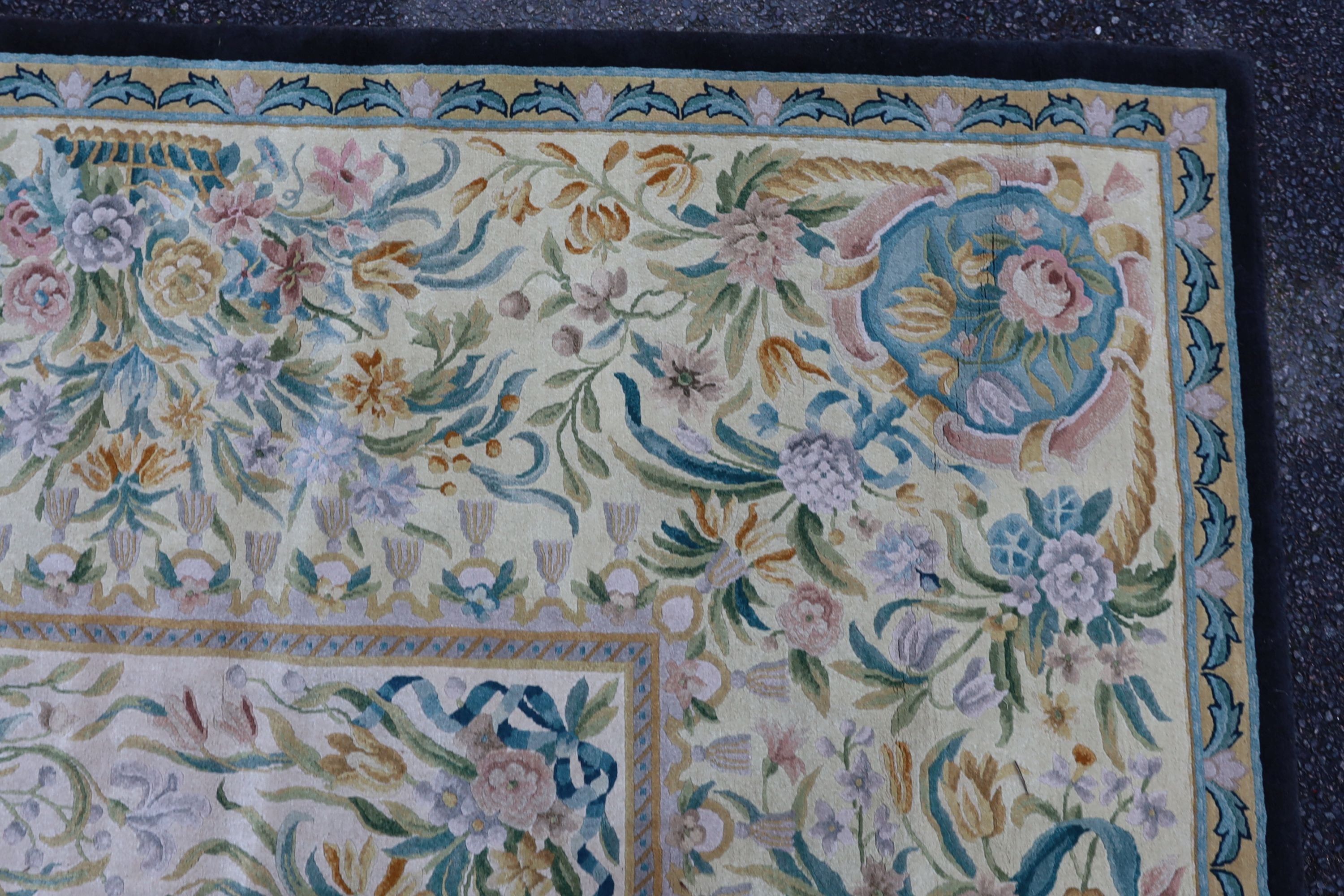 An Aubusson style ivory ground carpet, 372 x 274cm.